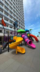 a playground with a slide and a slideintend at Salinas Beach Resort in Salinópolis