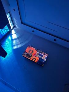 a magazine sitting on the floor in a blue room at Stoph in Beni Mellal