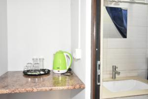 a kitchen counter with a blender and glasses on it at Zvartnots in Zvartnots International Airport