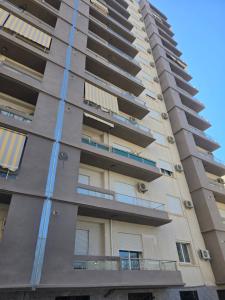 an apartment building with balconies on the side at Apparemment valmascort annaba in Annaba