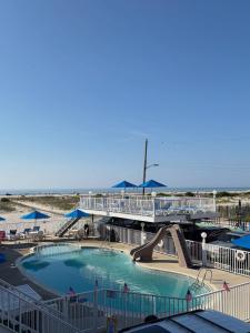 a swimming pool with a slide in a resort at Astronaut Motel in Wildwood Crest