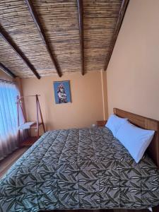 a bedroom with a large bed in a room at Mountain View Lodge & Experience in Cusco