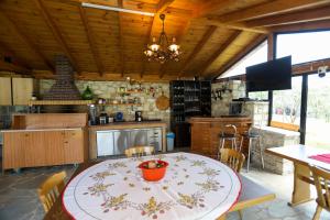 a kitchen with a table with a bowl on it at Guesthouse Micaj HORA in Himare