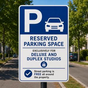 a parking sign for a reserved parking space at Studios - Appartements Le Médicis in Rouen