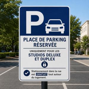 a parking sign in a parking lot with a car on it at Studios - Appartements Le Médicis in Rouen