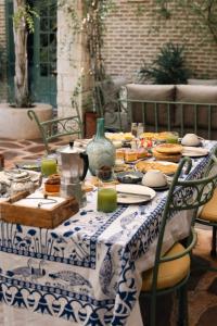 a blue and white table with food on it at Sel d Ailleurs, Ouirgan - adults only in Ouirgane
