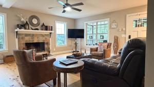a living room with a couch and a fireplace at Last house on the hill in Cleveland