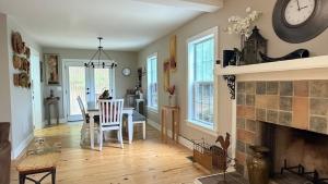 a dining room with a table and a fireplace at Last house on the hill in Cleveland