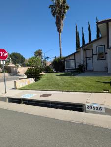 a stop sign on the side of a street at LA Lux Suite with Private Bathroom in Santa Clarita +3 photos