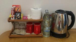 a wooden shelf with a coffee maker and a coffee pot at @Me2 Hotel in Phitsanulok +32 photos