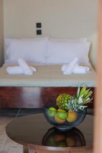 a bowl of fruit on a table in a room at Aspalathos guest rooms in Vathia