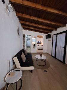 a living room with a couch and a table at La Campestre in La Guancha