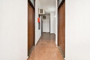 an empty hallway with two doors and a floor at Hotel O Pragati Inn in Jaipur