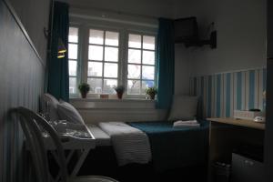 Rúm í herbergi á Bed & Breakfast Hotel Zandvoort