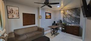 a living room with a couch and a table at Ballena Rey Hotel in Uvita
