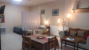a living room with a couch and a table at Terraza del Rio in Formosa