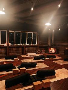 a large room with a room with a fire place at Hidden Valley Cabins & Tours in Coolbie