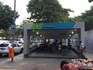 people are standing outside of a bacco gas station at Aragão Botafogo Studio in Rio de Janeiro