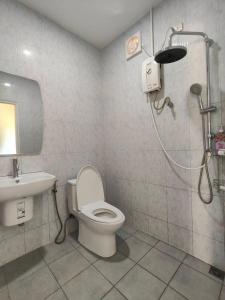 a bathroom with a toilet and a sink and a shower at First light beach bungalow in Ko Phangan