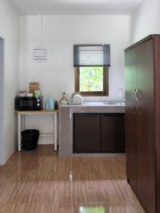 a kitchen with a sink and a counter top at First light beach bungalow in Ko Phangan
