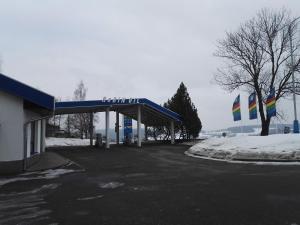 a gas station with a blue roof in the snow at ČS Robin Oil Kašperské Hory in Kašperské Hory