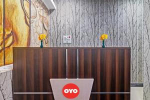 a noo sign on top of a partition with flowers at OYO 93463 Alwal Residency in Hyderabad