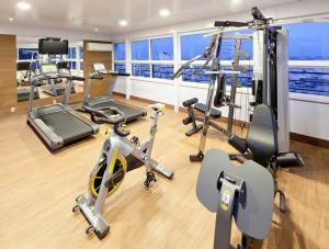 a gym on a cruise ship with exercise equipment at Premier Copacabana Hotel in Rio de Janeiro