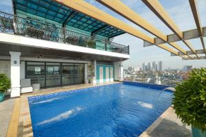 a swimming pool on the roof of a building at GM Hotel and Apartment in Hai Phong