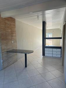 a empty room with a bench in the middle of it at Apto a 50m da ExpoCrato in Crato