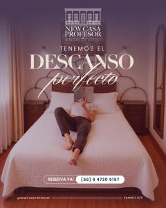 a man laying on a bed reading a book at NEW Hotel Casa del Profesor in Iquique