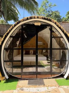 a round tent with a bed inside of it at Cocoon De Coron in Coron