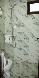 a white bathroom with a toilet and a window at Niss House2 in Akhaltsikhe +40 photos