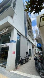 a group of motorcycles parked outside of a building at Volos Blue Nest in Volos