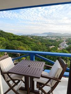 a table and chairs on a balcony with a view at Top de Buzios Boutique Hotel & Spa in Búzios
