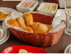 a basket of bread sitting on a table at Pousada Iandara in Pirenópolis