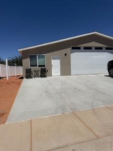 a garage with a car parked in front of it at Desert view apartment in Page