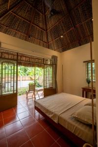 a bedroom with a large bed in a room at Mango Home in Ben Tre
