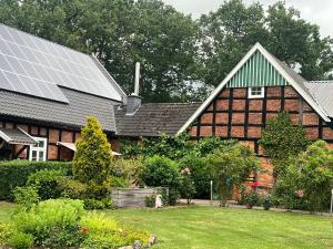 a house with solar panels on the roof at Ferienwohnung am Halbmond in Badbergen