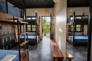 a hallway with bunk beds in a dorm room at The Laneway Hostel in Xuân Sơn