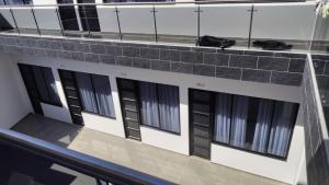 a building with black windows on the side of it at Hotel Boutique 1801 in San Juan de Rioseco 