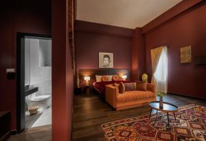 a living room with a couch and a bathroom at Inpeng View Hotel in Vientiane