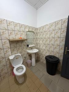 a bathroom with a toilet and a sink at My stay in Yaoundé