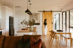 a living room with a couch and a table at Monapilla Escape in McLaren Vale +38 photos