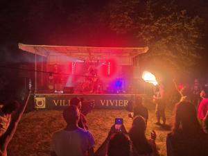a group of people watching a concert at night at Rhône Studio avec terrace parking privé in Viviers