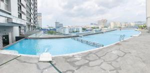 a large swimming pool on top of a building at Female Hostel wakakapacker in Kuala Lumpur