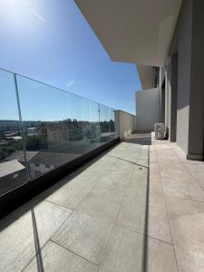 an empty room with a view of a building at Best Luxury Residence in Bistriţa