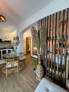 a living room with a vase with a plant in it at Avra Guesthouse in Limenas