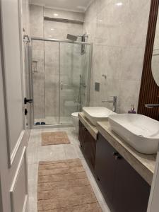 a bathroom with a shower and a sink and a toilet at Villa suit in Trabzon +43 photos