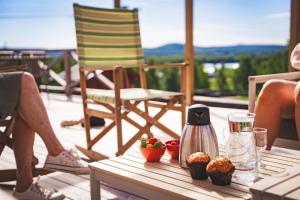a table with a coffee maker and muffins on a patio at Mukka Mountain in Ruskola