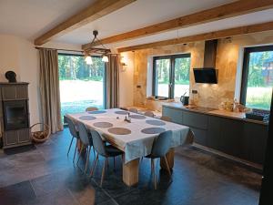 a kitchen with a table and chairs in a room at Chalet Martinky in Martin